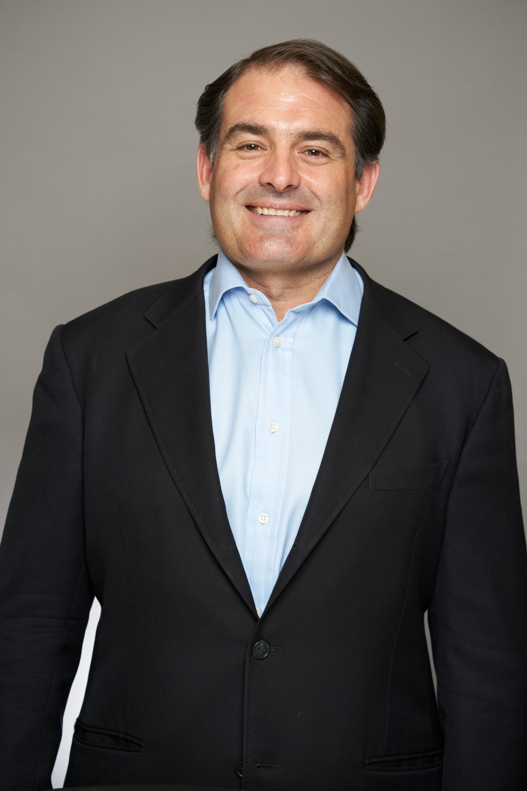 Michael Iluliano wearing a suit